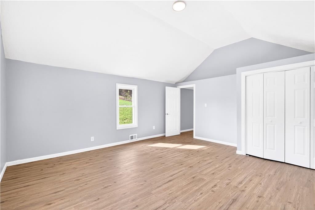 93 Old 51 Road Perryopolis, PA 15473 - Photo 24 of 44 an empty room with wooden floor and windows