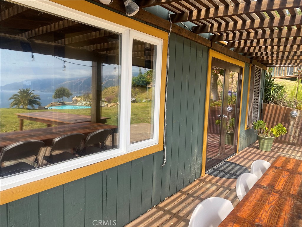 0 Morning Glory Ranch Big Sur, CA 93920 - Photo 11 of 35 a bedroom with a bed and a large window