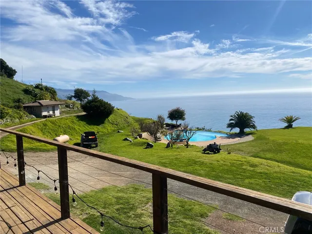 a view of a garden and deck