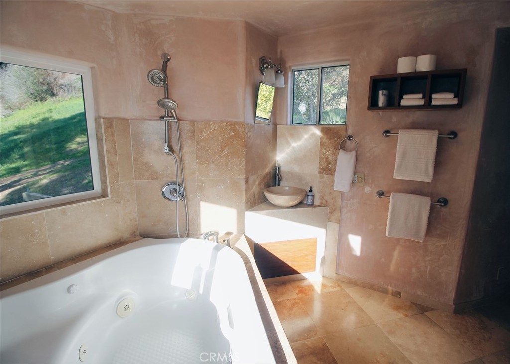 0 Morning Glory Ranch Big Sur, CA 93920 - Photo 17 of 35 a living room with furniture and a flat screen tv