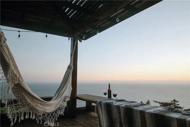 a view of a balcony with chairs