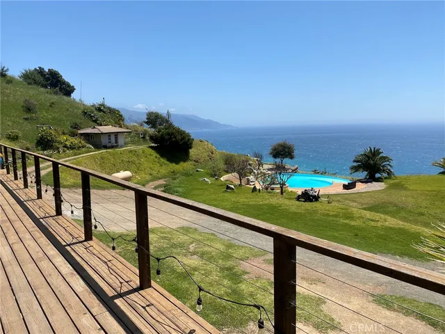a view of a balcony with an ocean view