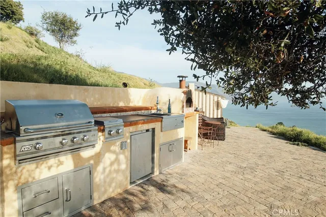 a view of a kitchen with chair and stove