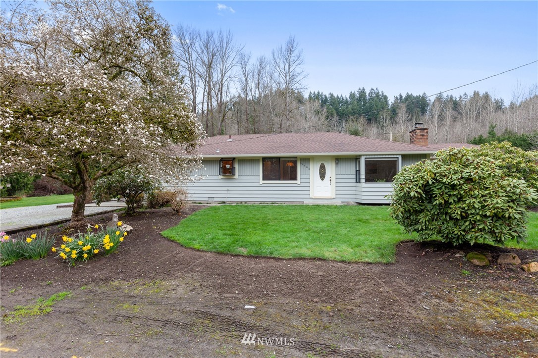 15408 Southeast Jones Road Renton, WA 98058 - Photo 1 of 40 a view of a house with a garden