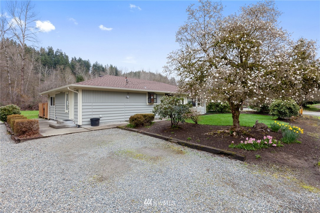 15408 Southeast Jones Road Renton, WA 98058 - Photo 2 of 40 a front view of a house with garden