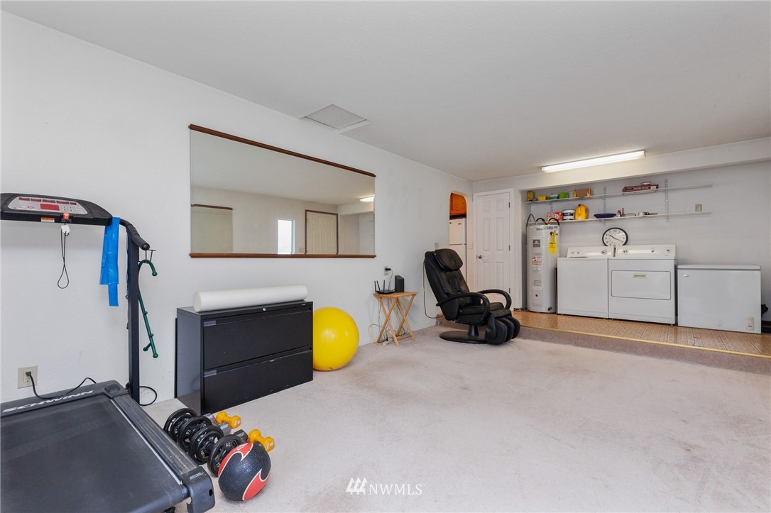 15408 Southeast Jones Road Renton, WA 98058 - Photo 16 of 40 a view of a livingroom with furniture and toys