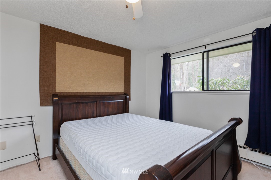 15408 Southeast Jones Road Renton, WA 98058 - Photo 18 of 40 a bedroom with a bed and a window