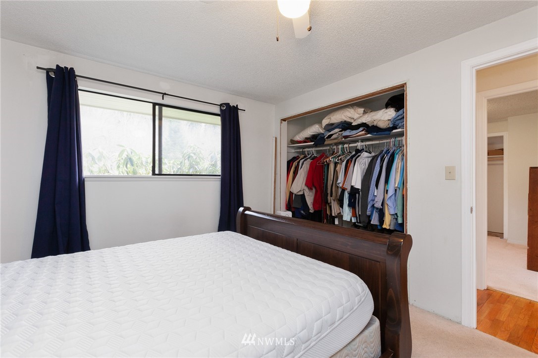 15408 Southeast Jones Road Renton, WA 98058 - Photo 21 of 40 a bedroom with a bed and a window