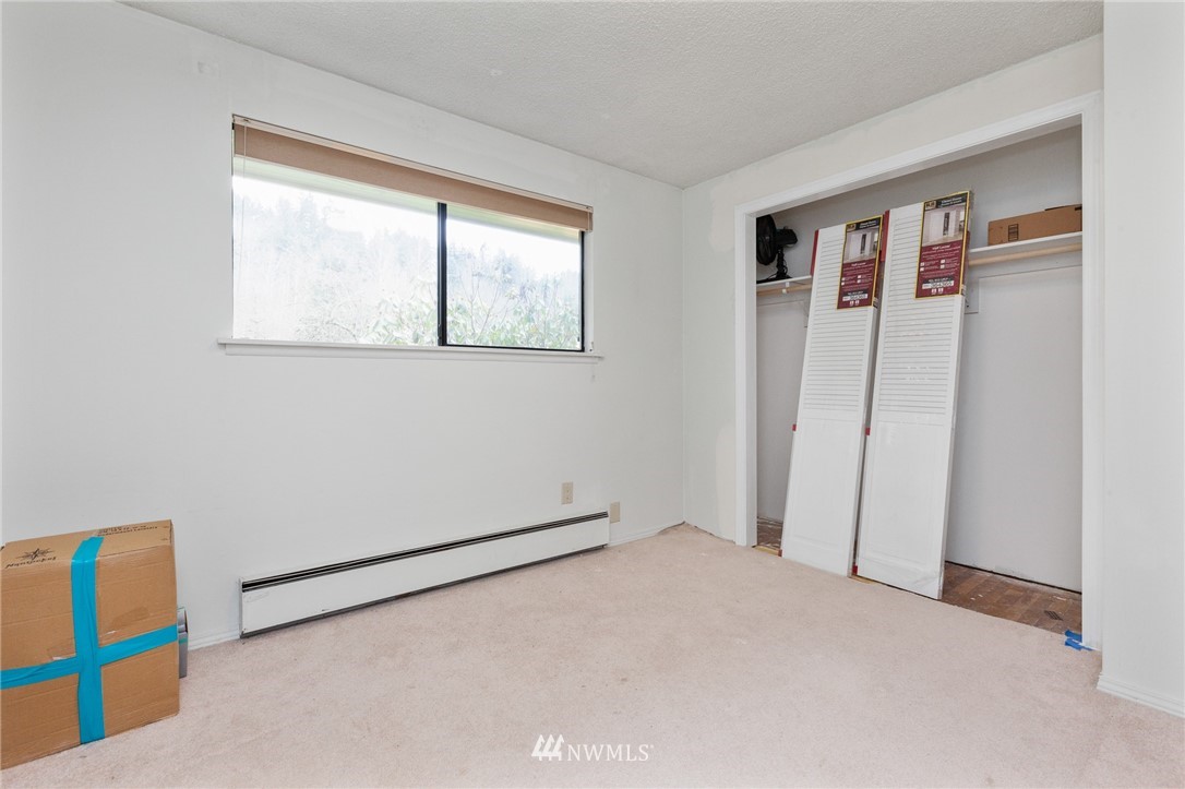 15408 Southeast Jones Road Renton, WA 98058 - Photo 22 of 40 a view of an empty room with windows