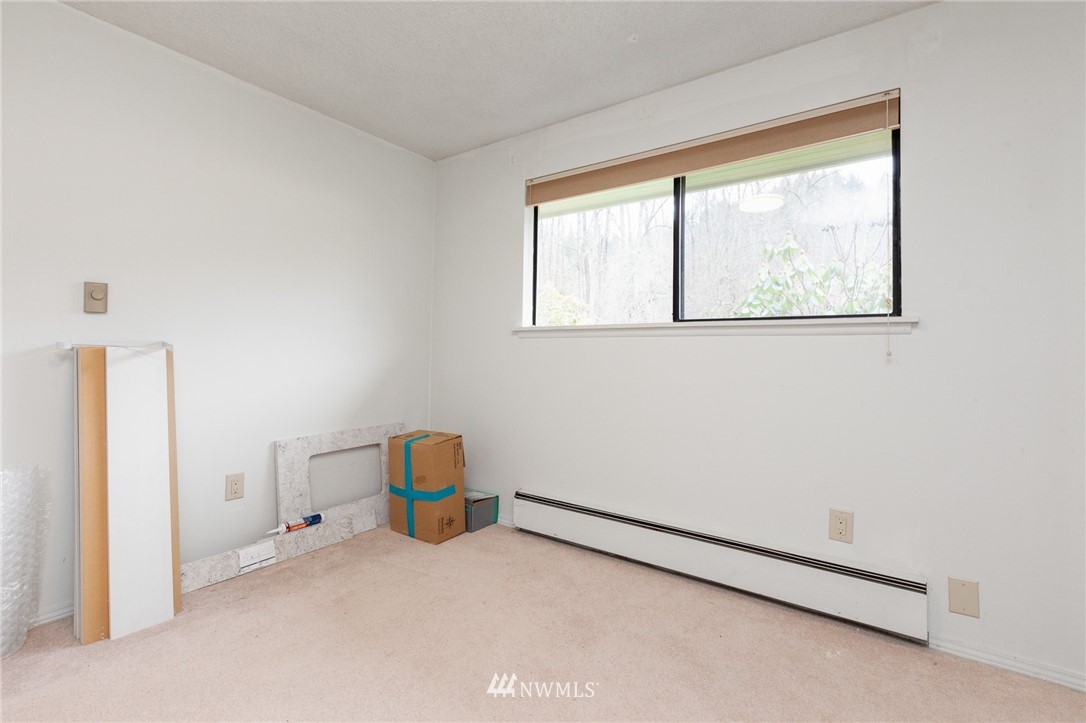 15408 Southeast Jones Road Renton, WA 98058 - Photo 23 of 40 a view of room with baby crib and a window