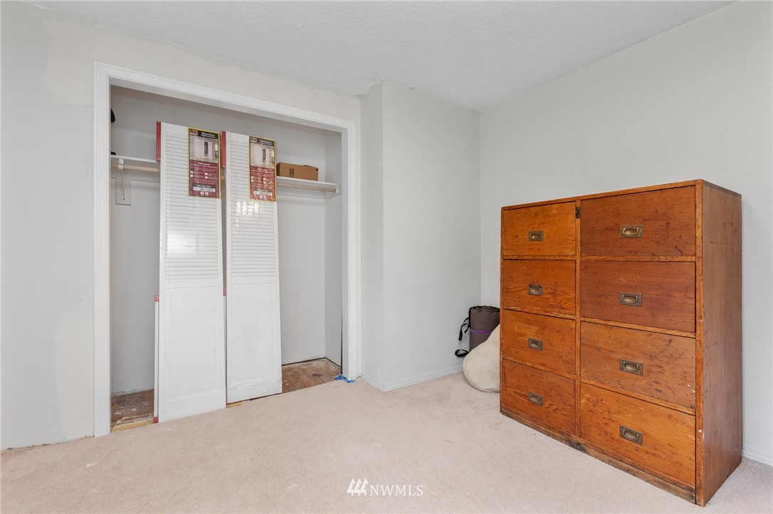 15408 Southeast Jones Road Renton, WA 98058 - Photo 25 of 40 a bedroom with a bed and a mirror