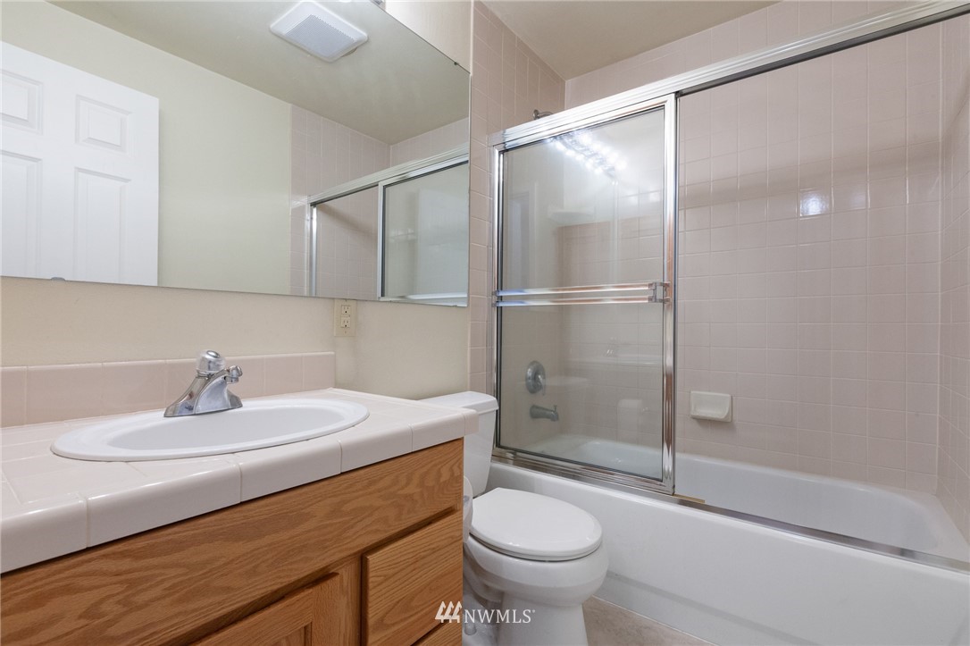 15408 Southeast Jones Road Renton, WA 98058 - Photo 30 of 40 a bathroom with a sink toilet and shower