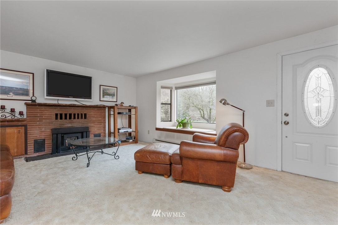 15408 Southeast Jones Road Renton, WA 98058 - Photo 4 of 40 a living room with furniture and a flat screen tv