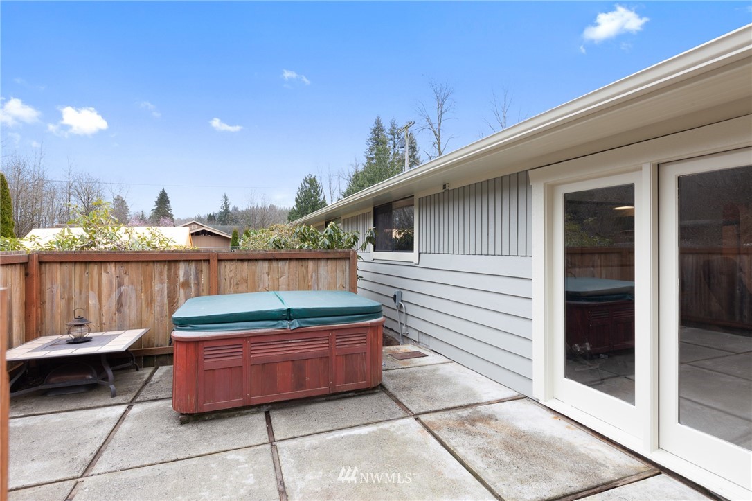 15408 Southeast Jones Road Renton, WA 98058 - Photo 31 of 40 a backyard of a house with barbeque oven and outdoor seating