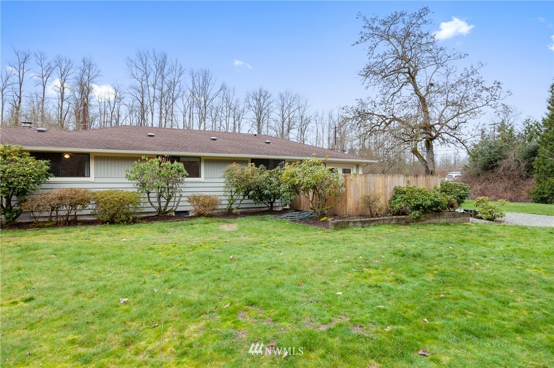 15408 Southeast Jones Road Renton, WA 98058 - Photo 32 of 40 a front view of a house with garden