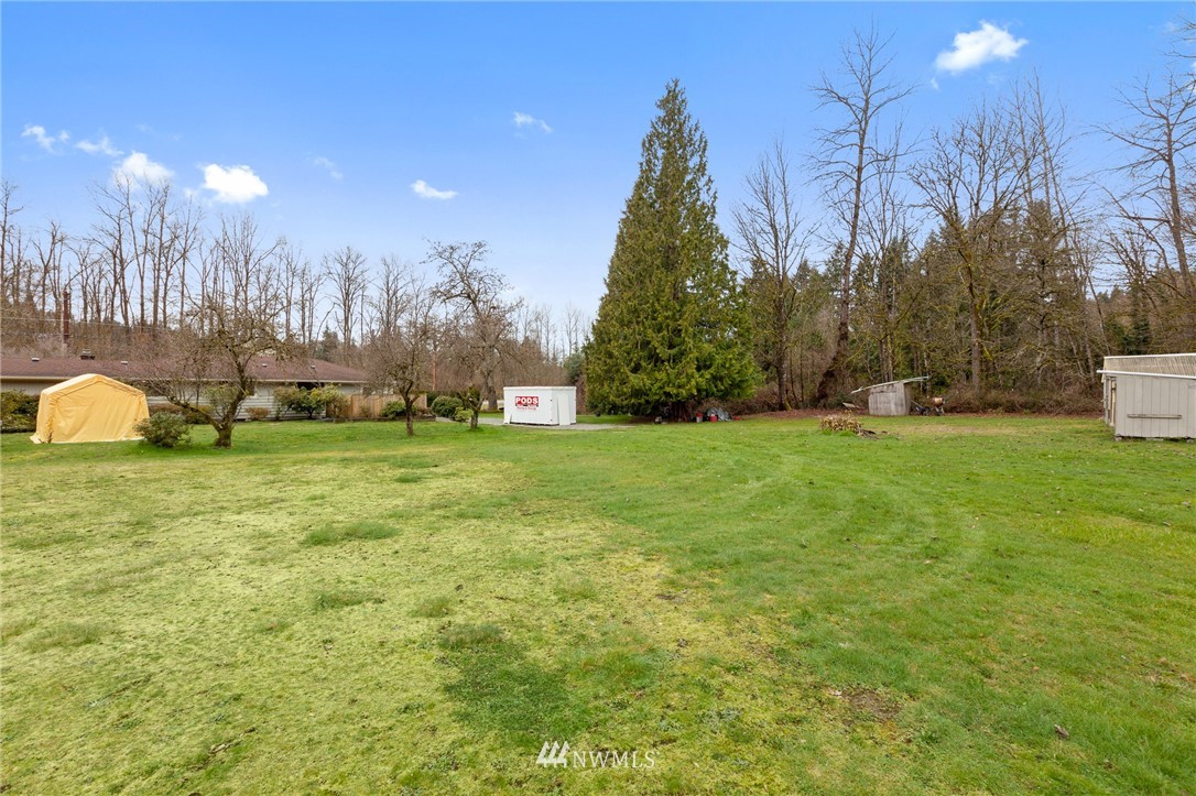 15408 Southeast Jones Road Renton, WA 98058 - Photo 34 of 40 a swimming pool with outdoor seating and yard