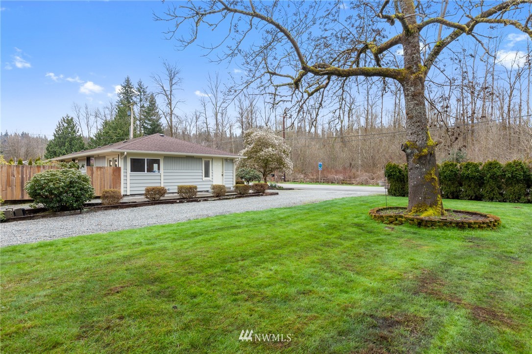15408 Southeast Jones Road Renton, WA 98058 - Photo 35 of 40 a front view of a house with garden and trees