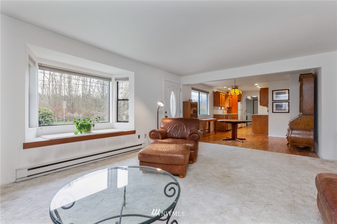 15408 Southeast Jones Road Renton, WA 98058 - Photo 5 of 40 a living room with furniture and a large window