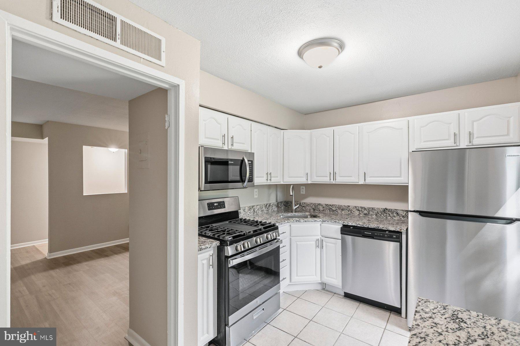 5866 Thunder Hill Road, Unit A4 Columbia, MD 21045 - Photo 3 of 21 Kitchen with brand-new appliances and a countertop