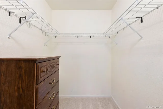 a view of a utility room with cabinets