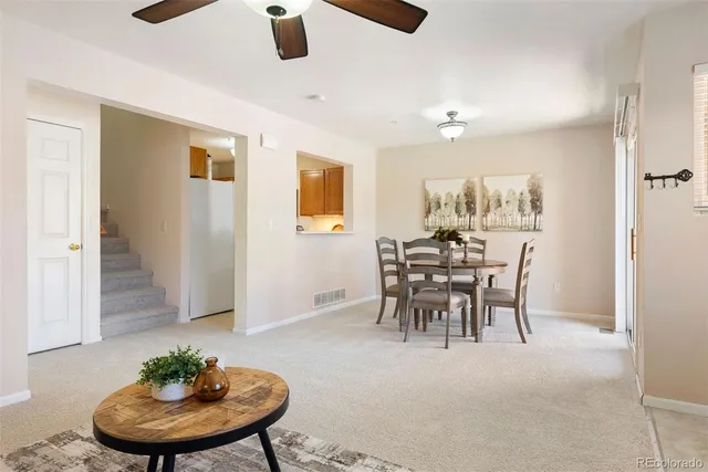 a dining room with furniture and window
