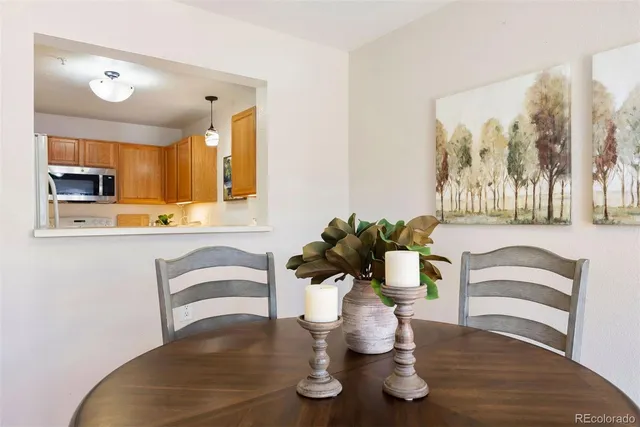 a dining room with furniture and wooden floor