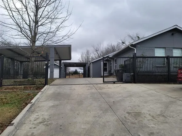 a view of a house with a yard and garage