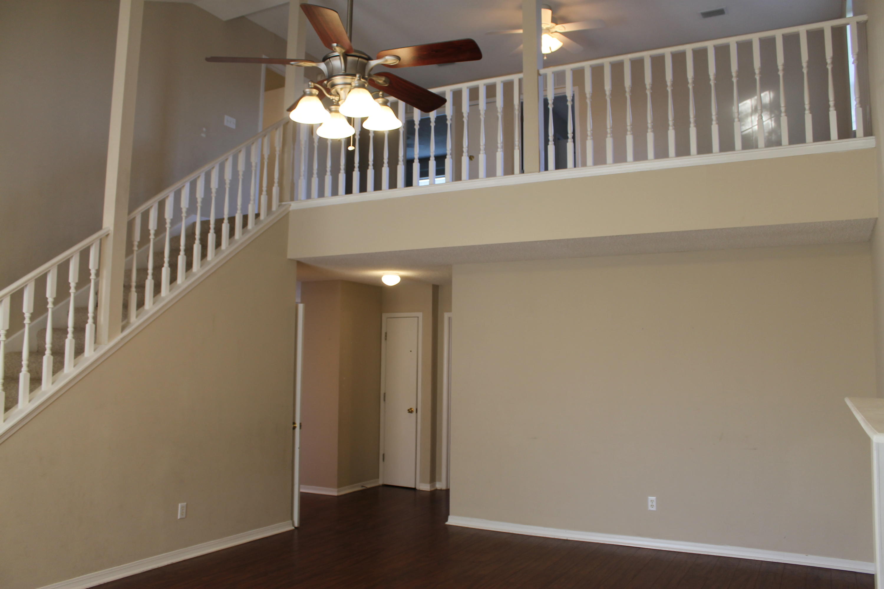 13 Holly Road Crestview, FL 32539 - Photo 3 of 19 a view of staircase with railing and a chandelier