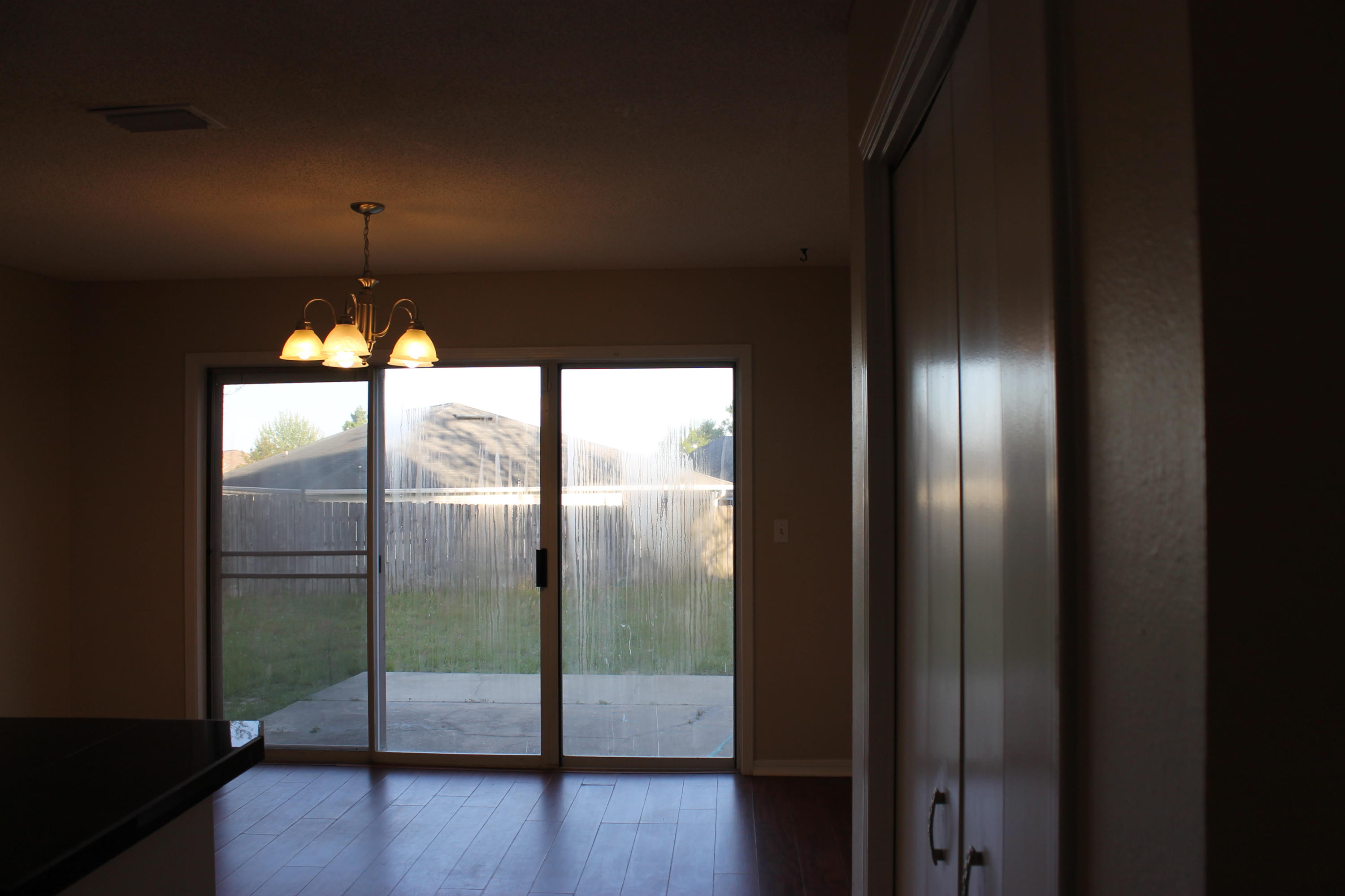 13 Holly Road Crestview, FL 32539 - Photo 8 of 19 a view of empty room with wooden floor and fan