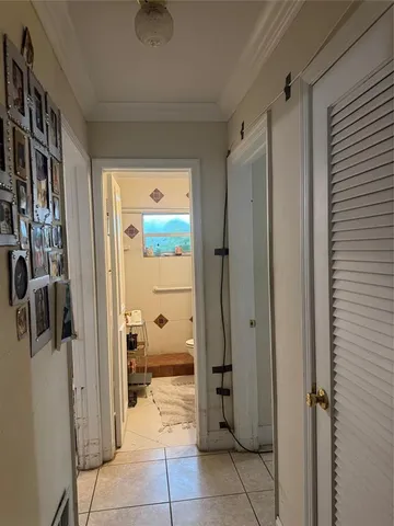 a bathroom with a granite countertop sink mirror vanity and toilet
