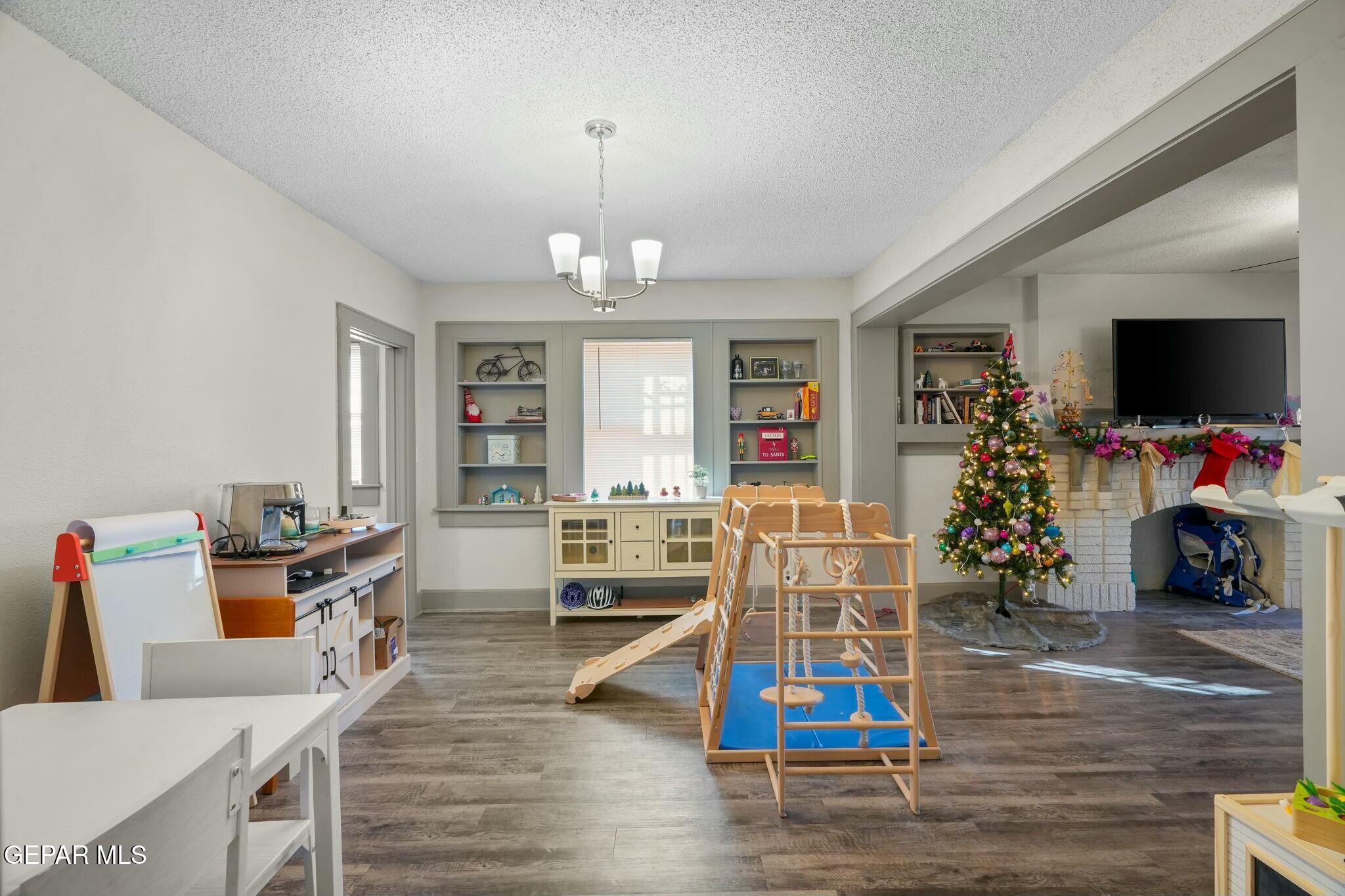 500 Fewel Street, Unit A & B El Paso, TX 79902 - Photo 11 of 61 a view of a livingroom with dining room and wooden floor