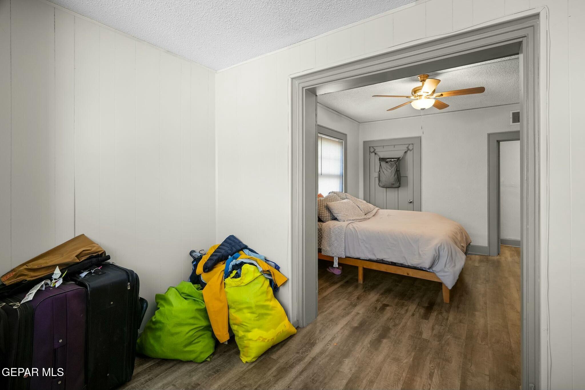 500 Fewel Street, Unit A & B El Paso, TX 79902 - Photo 15 of 61 a bedroom with a bed and a lamp on dresser