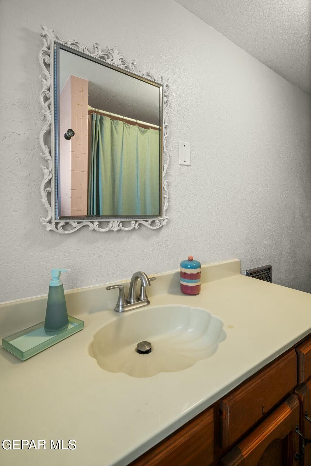 500 Fewel Street, Unit A & B El Paso, TX 79902 - Photo 18 of 61 a bathroom with a sink and a mirror