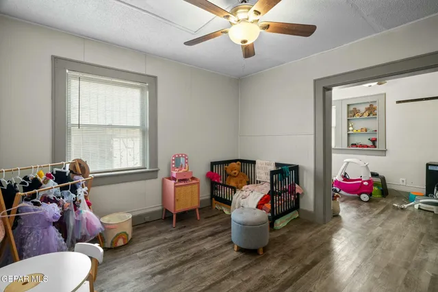 a view of a room with baby toys and wooden floor