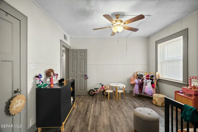 a kitchen with a refrigerator and a table