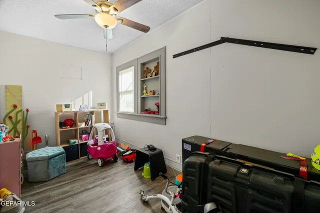 a kitchen with stainless steel appliances and white cabinets