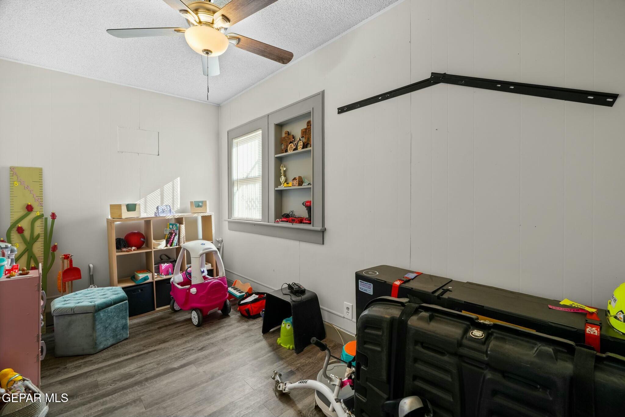 500 Fewel Street, Unit A & B El Paso, TX 79902 - Photo 21 of 61 a view of a room with baby toys and wooden floor