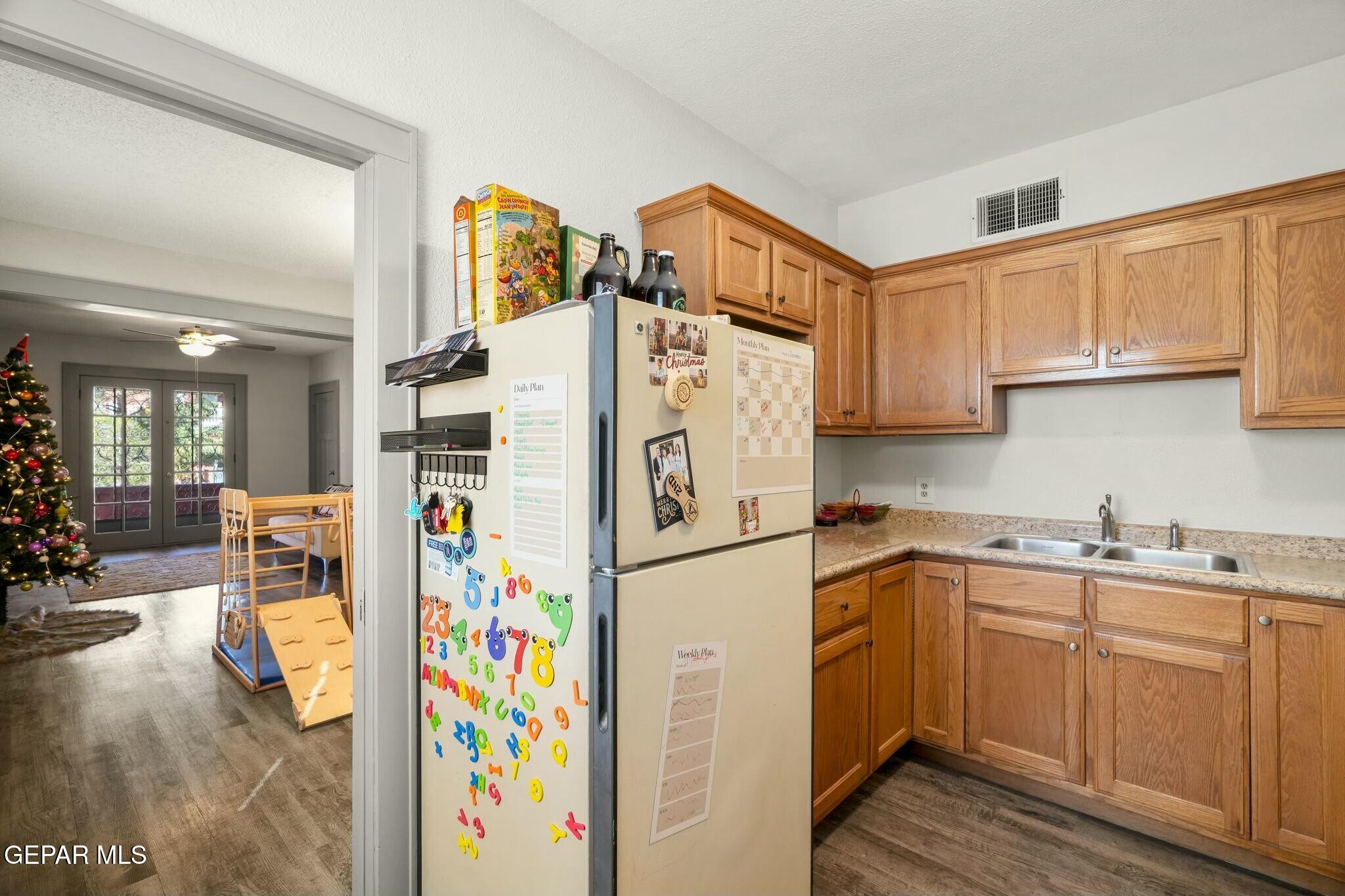 500 Fewel Street, Unit A & B El Paso, TX 79902 - Photo 25 of 61 a kitchen with stainless steel appliances and white cabinets