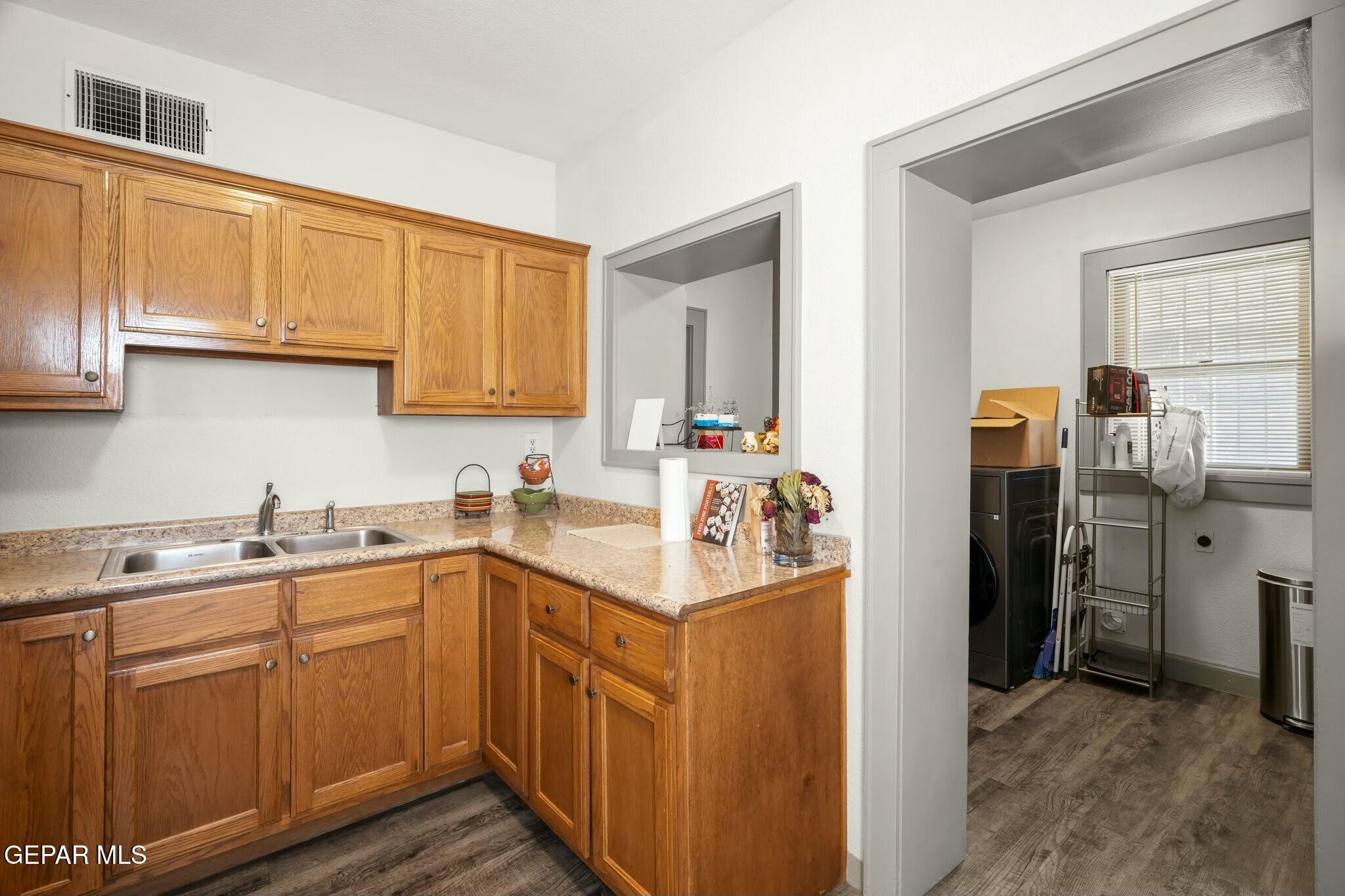 500 Fewel Street, Unit A & B El Paso, TX 79902 - Photo 27 of 61 a kitchen with a sink a refrigerator and cabinets