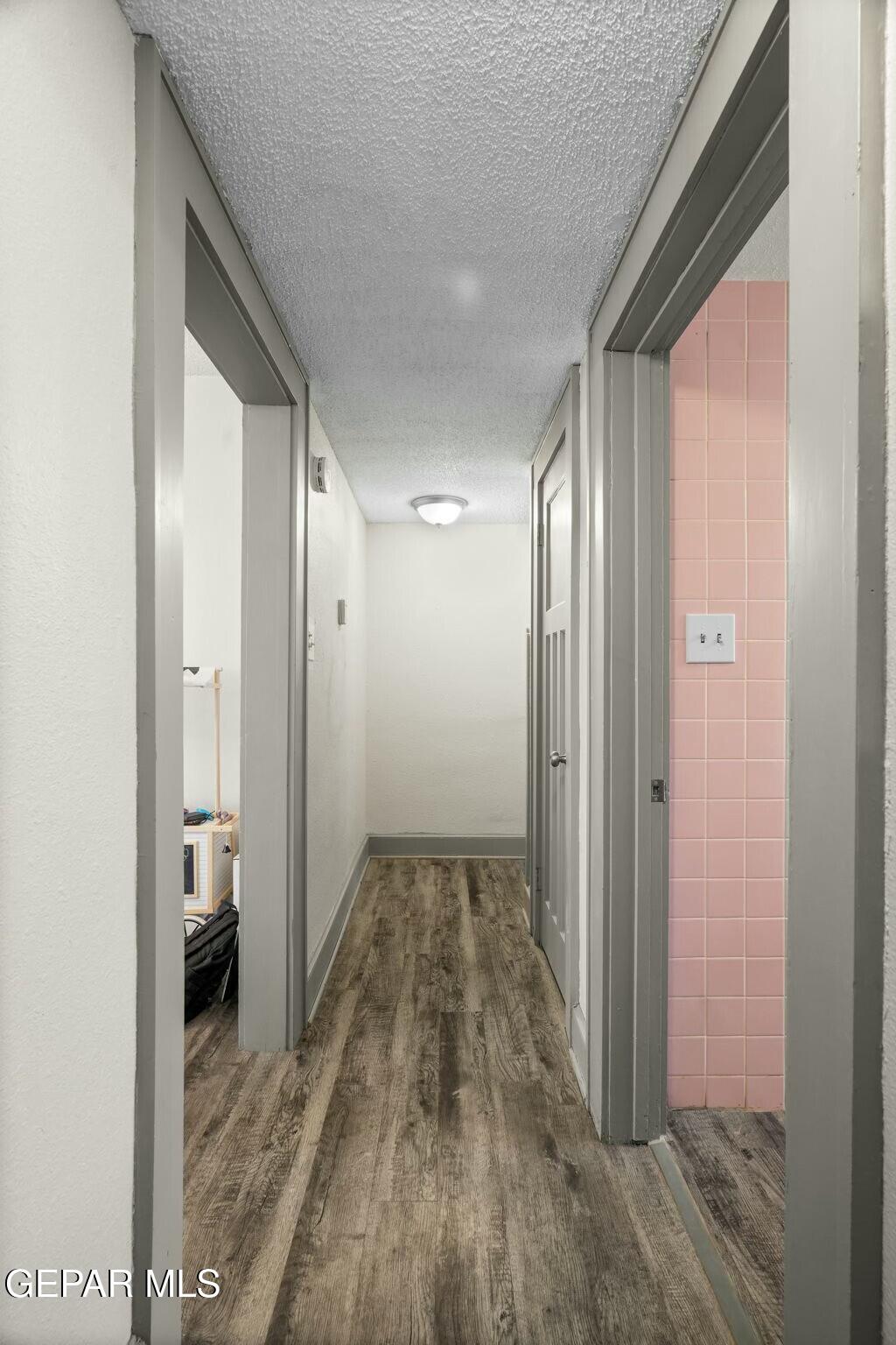 500 Fewel Street, Unit A & B El Paso, TX 79902 - Photo 29 of 61 a view of a hallway with wooden floor and a bathroom