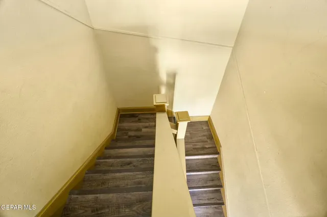a kitchen with a refrigerator and a sink