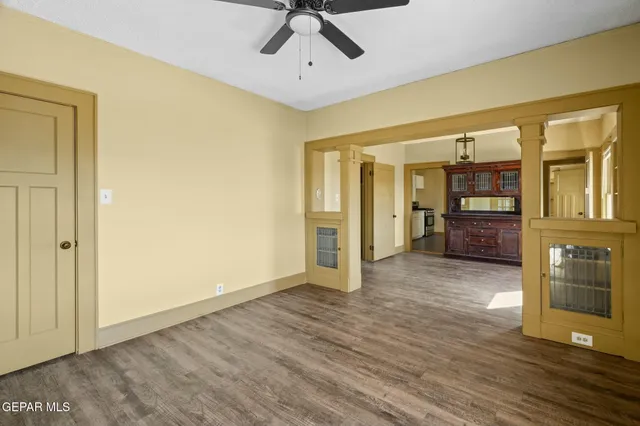 a kitchen with white cabinets and appliances