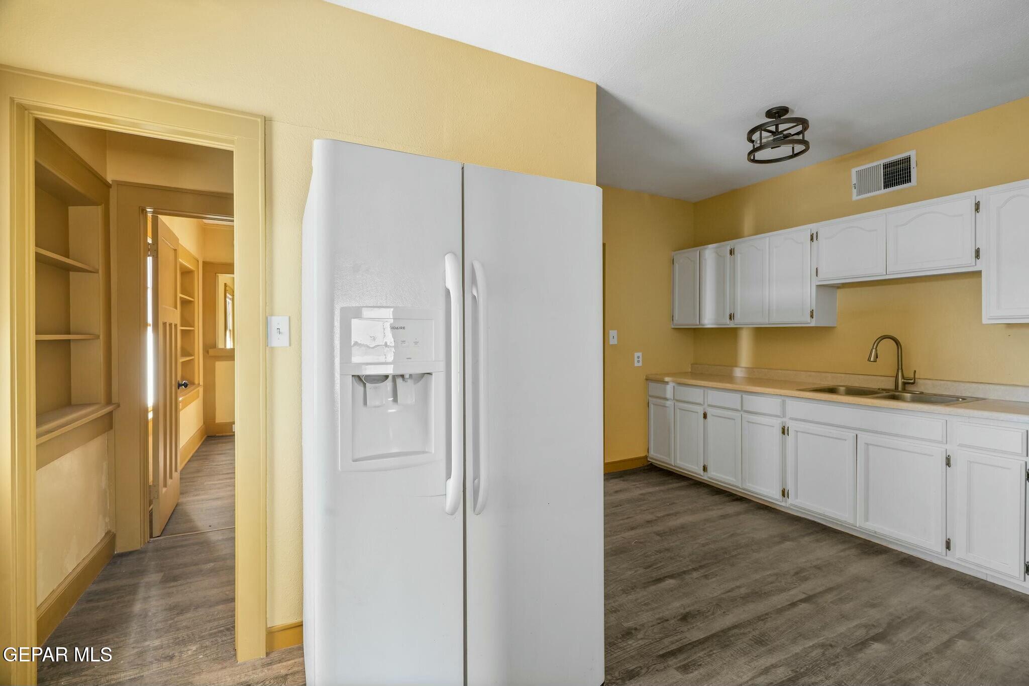 500 Fewel Street, Unit A & B El Paso, TX 79902 - Photo 39 of 61 a kitchen with a refrigerator and a sink
