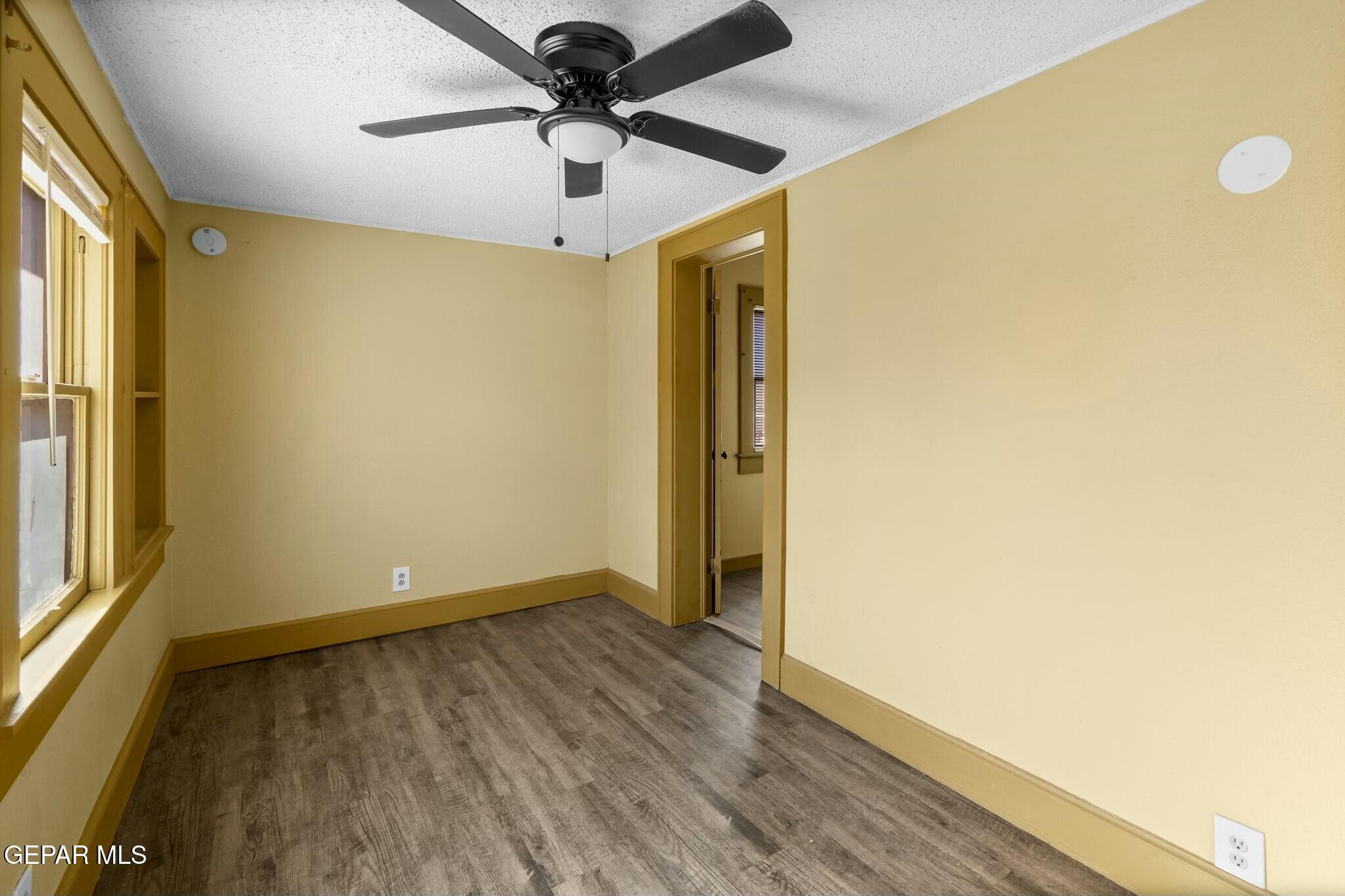 500 Fewel Street, Unit A & B El Paso, TX 79902 - Photo 43 of 61 a view of room with wooden floor and ceiling fan