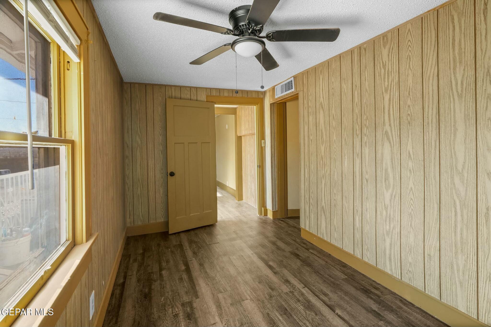 500 Fewel Street, Unit A & B El Paso, TX 79902 - Photo 45 of 61 a view of a big room with wooden floor and windows