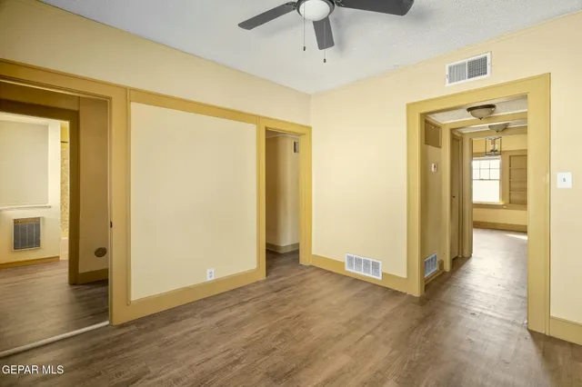 a view of a hall with wooden floor