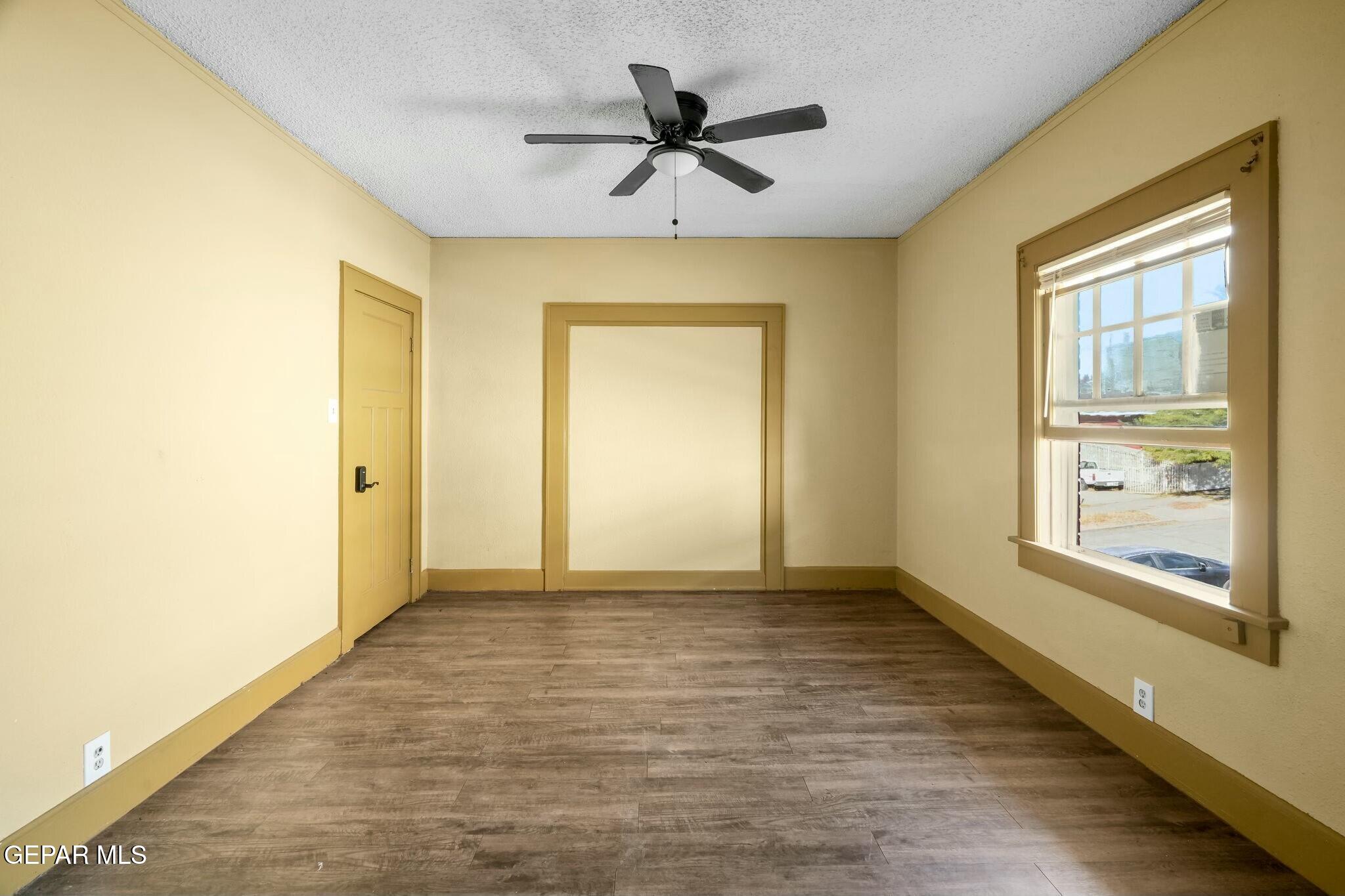 500 Fewel Street, Unit A & B El Paso, TX 79902 - Photo 51 of 61 wooden floor in an empty room with a window