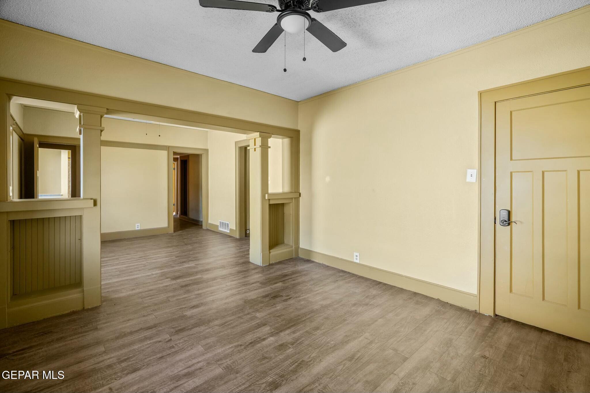 500 Fewel Street, Unit A & B El Paso, TX 79902 - Photo 52 of 61 a view of an empty room with wooden floor and a ceiling fan