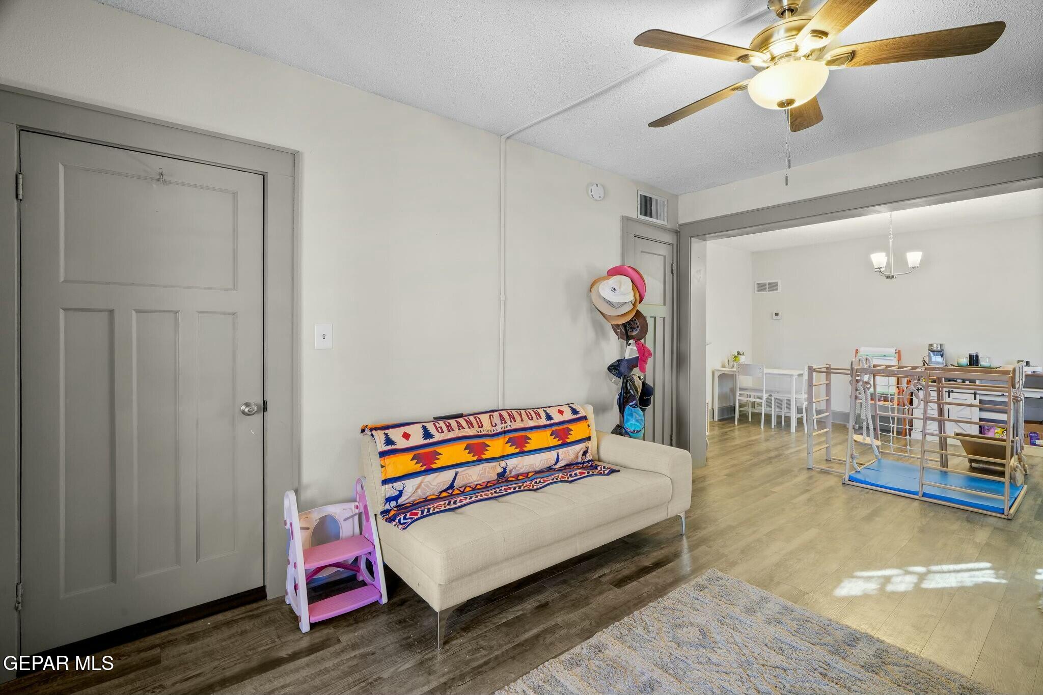 500 Fewel Street, Unit A & B El Paso, TX 79902 - Photo 7 of 61 a living room with furniture a rug and a chandelier