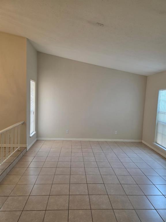10371 White Elm Road Dallas, TX 75243 - Photo 4 of 11 Unfurnished room featuring light tile patterned floors